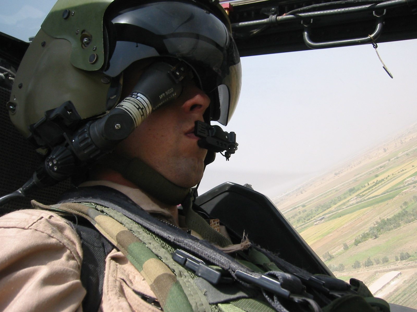 Brian Bergen in the cockpit of an Apache helicopter